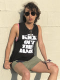 youth sits on walls with black MC5 KICK OUT THE JAMS festival tank top