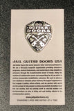 Jail Guitar Doors Enamel Pin made from metal with profits towards Prison Reform-  These classic lines by Joe Strummer from The Clash planted the seeds for Jail Guitar Doors USA, a non-profit organization founded by musicians Wayne Kramer and Billy Bragg, which brings the gift of music to the incarcerated.  