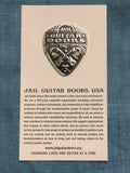 Jail Guitar Doors Enamel Pin made from metal with profits towards Prison Reform-  These classic lines by Joe Strummer from The Clash planted the seeds for Jail Guitar Doors USA, a non-profit organization founded by musicians Wayne Kramer and Billy Bragg, which brings the gift of music to the incarcerated.  